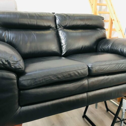 leather black sofa with new stuffing